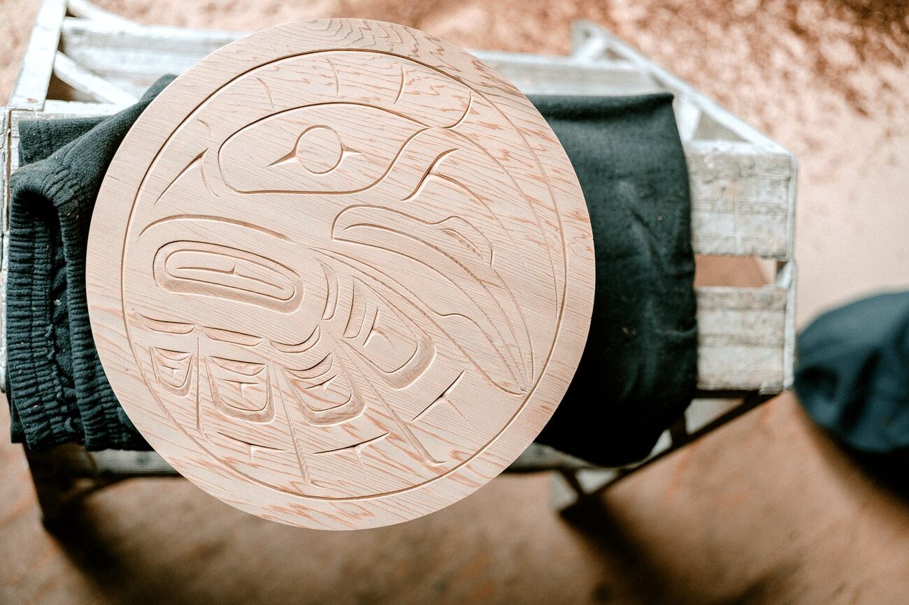 A carved moon and eagle roundel in cedar, in progress