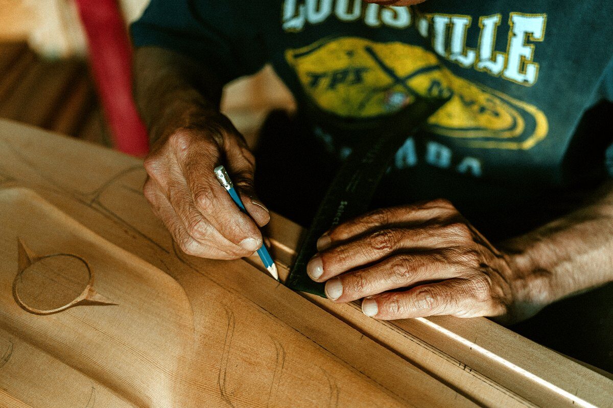 Ross Henderson drawing formline before carving