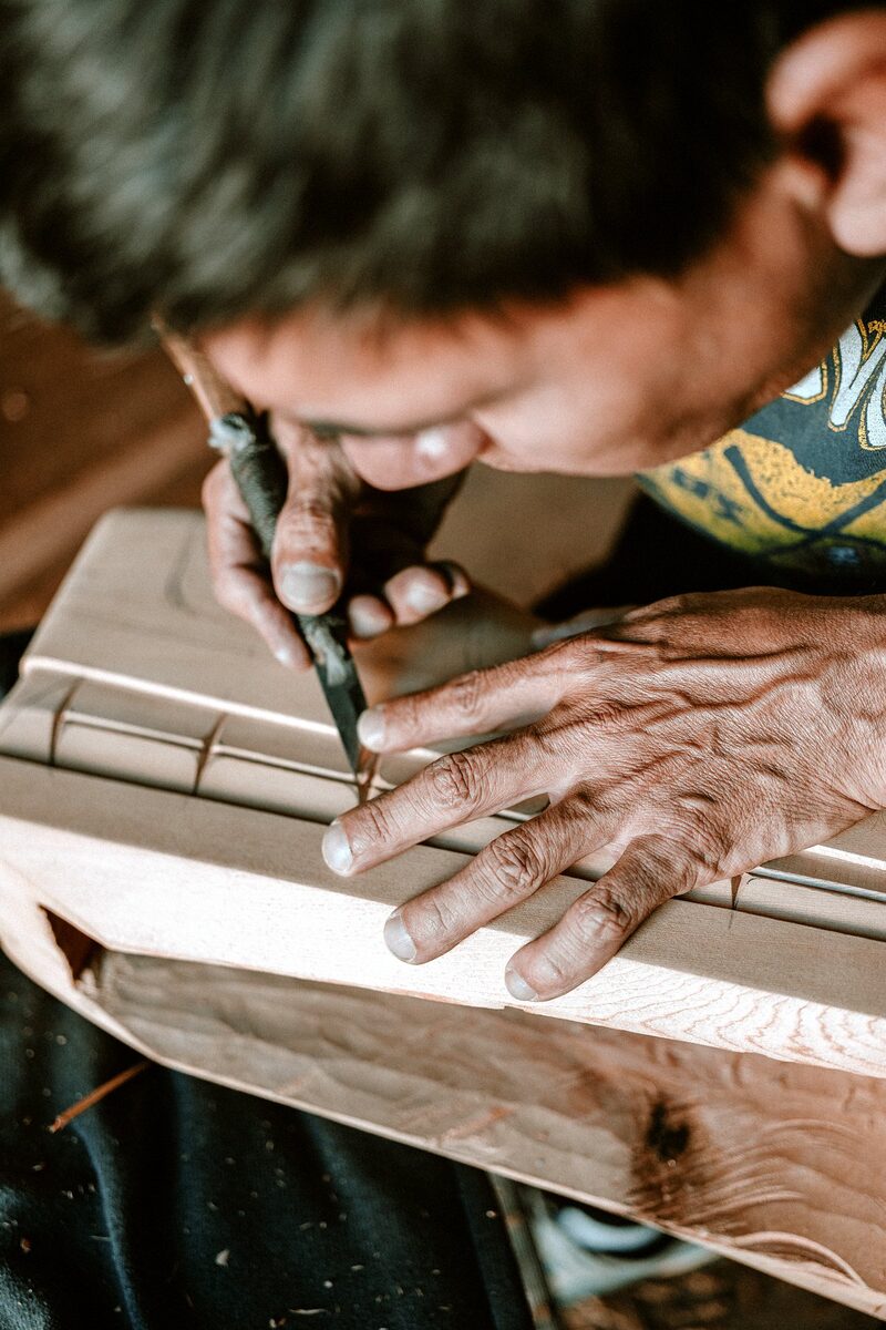 Carving formline into cedar by hand